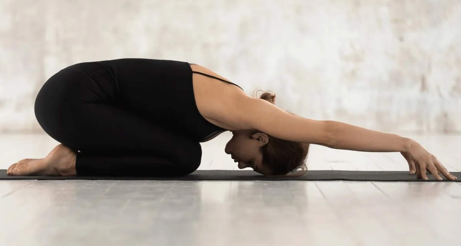 girl doing Child's Pose-Balasana