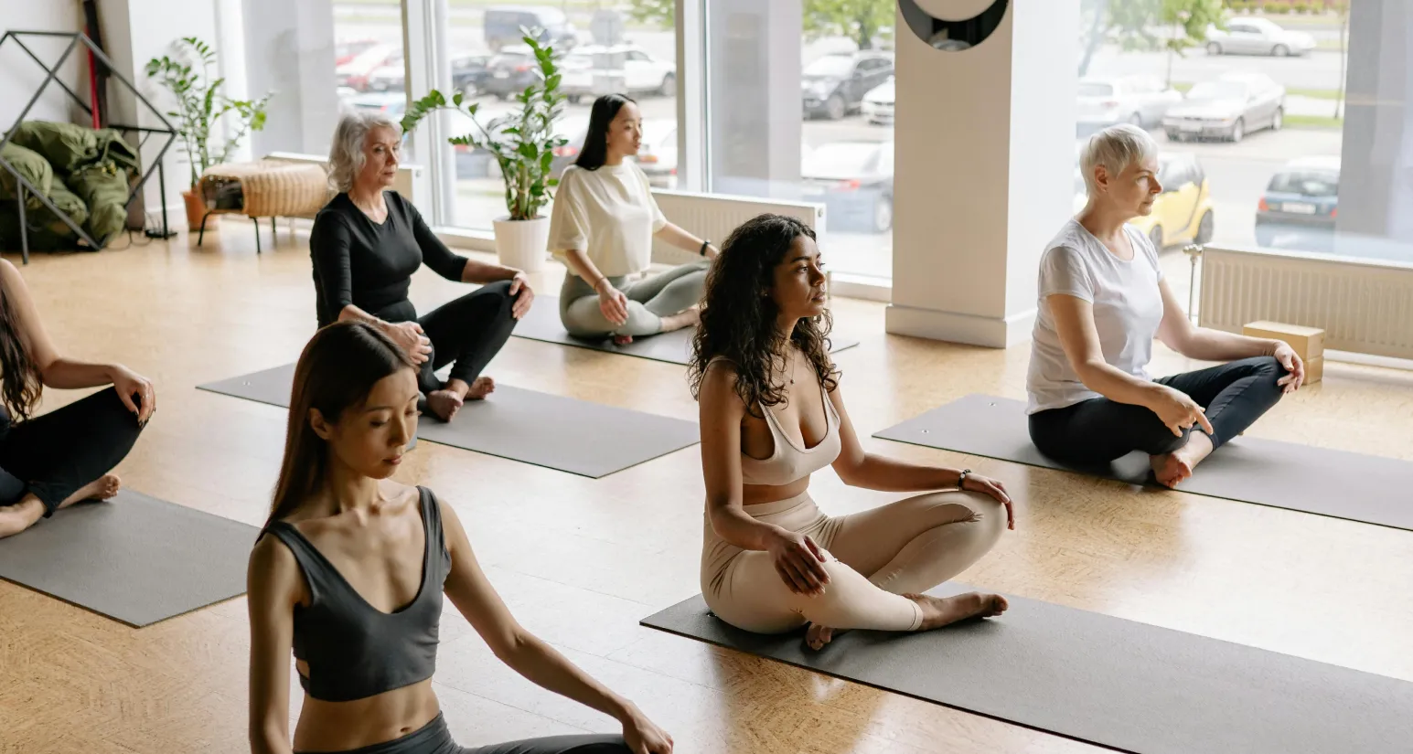 a group of women doing yoga at Yogabase yoga studio in camden london